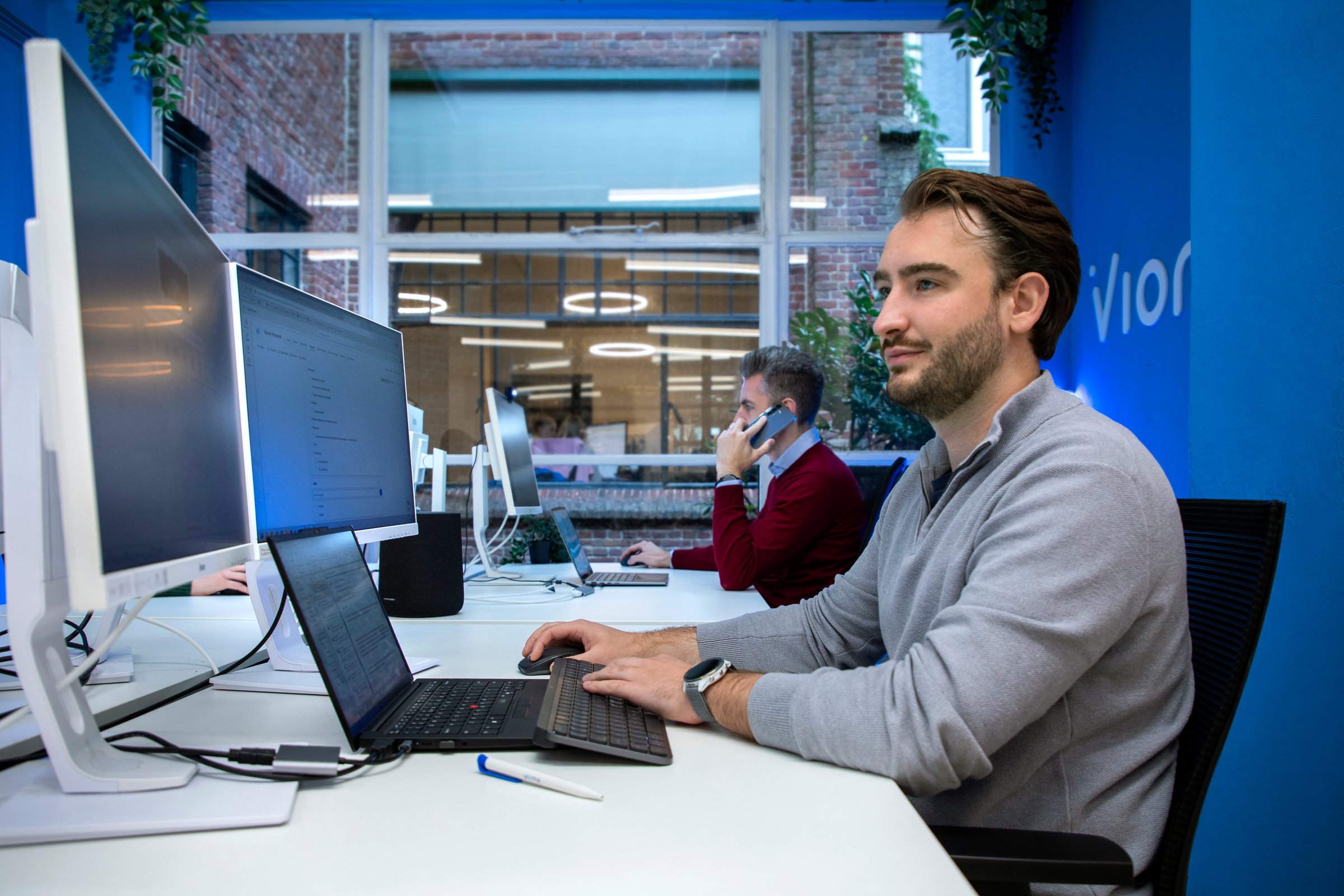 VionA colleague working on their laptop at the office