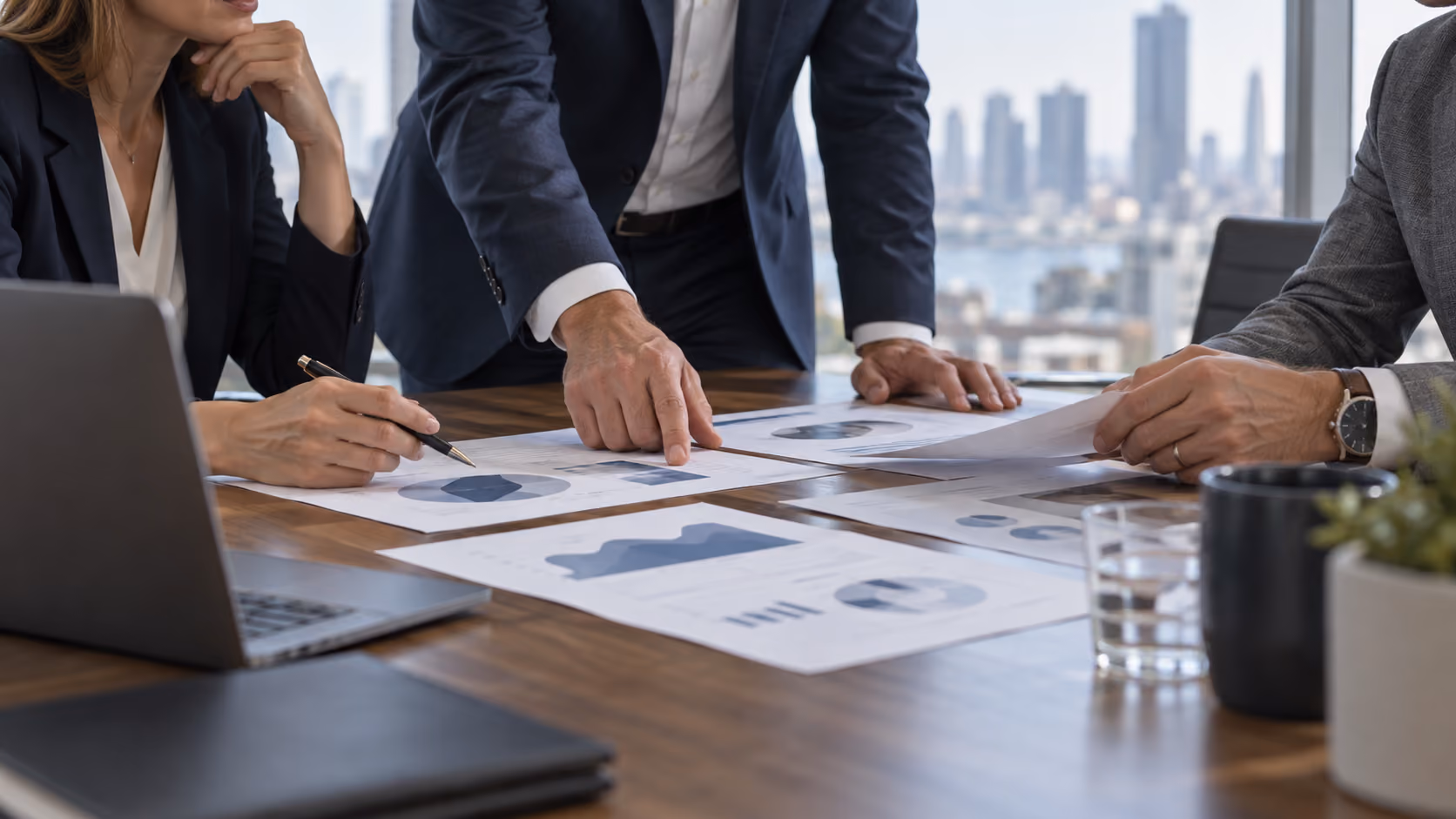 Finance team aligning portfolio charts before a decision
