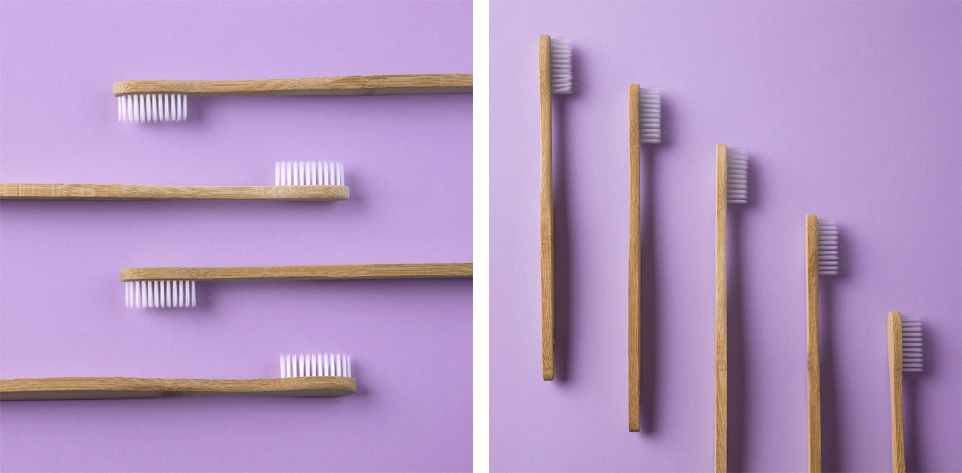 Bamboo toothbrushes and straws on lilac