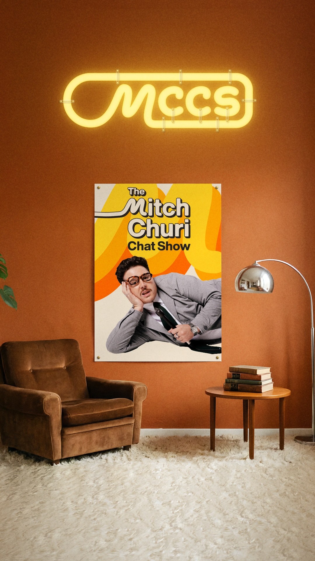 Still from the brand reel: the key art as a poster on an orange retro wall under an MCCS neon