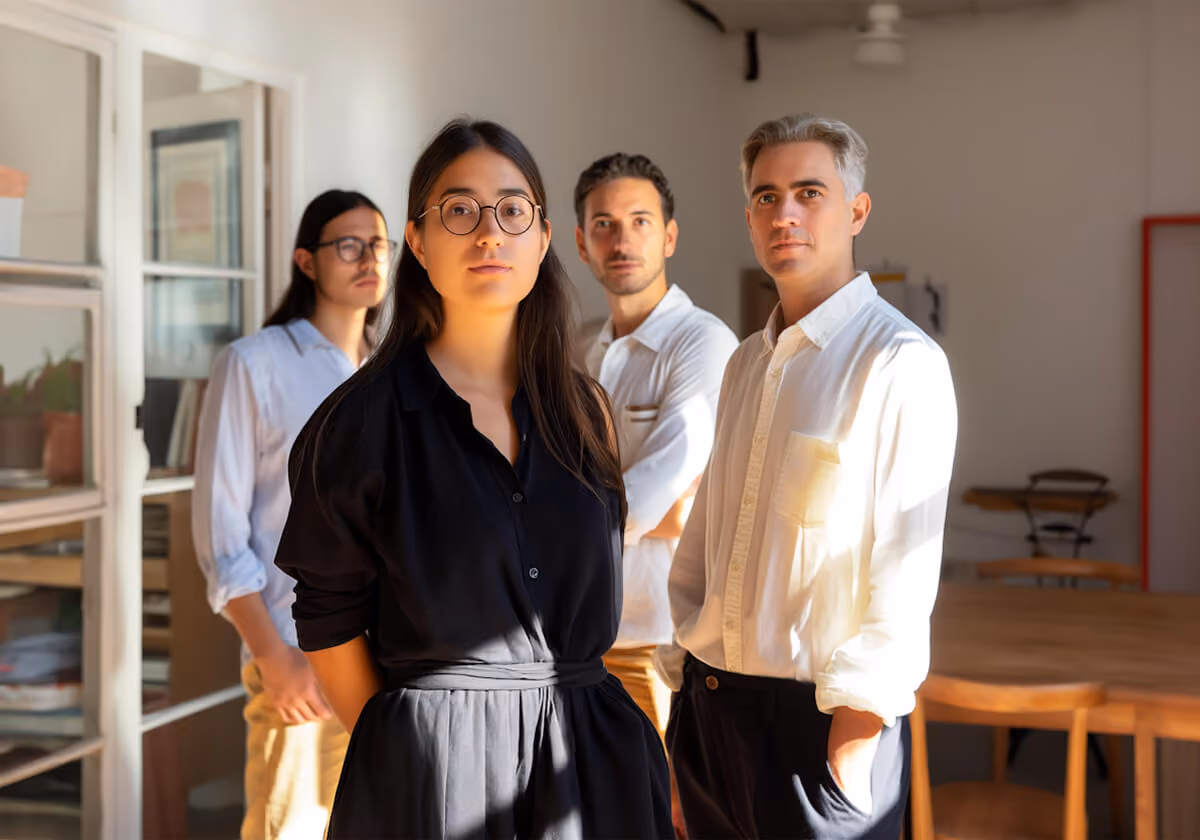 Four-member business team in their office.