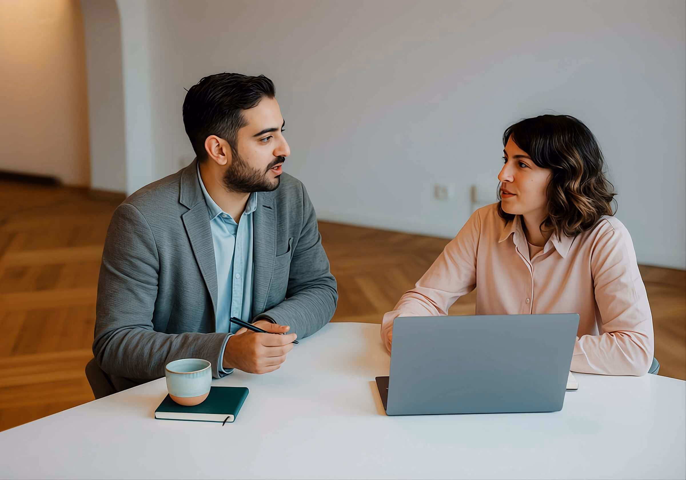 Two business team members discussing their ideas.
