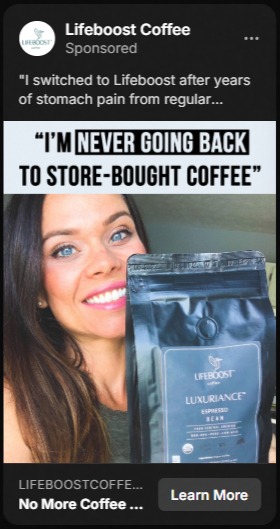 Smiling woman holding a black bag of Lifeboost Luxuriance Espresso coffee beans with text above stating 'I'M NEVER GOING BACK TO STORE-BOUGHT COFFEE'.
