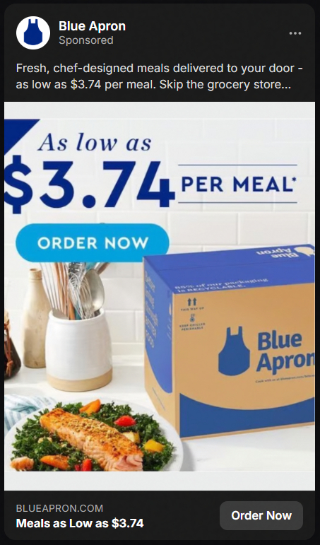 Blue Apron advertisement showing a meal with cooked salmon and vegetables on a plate, a jar of utensils, and a Blue Apron delivery box, promoting meals as low as $3.74 per meal with an order now button.