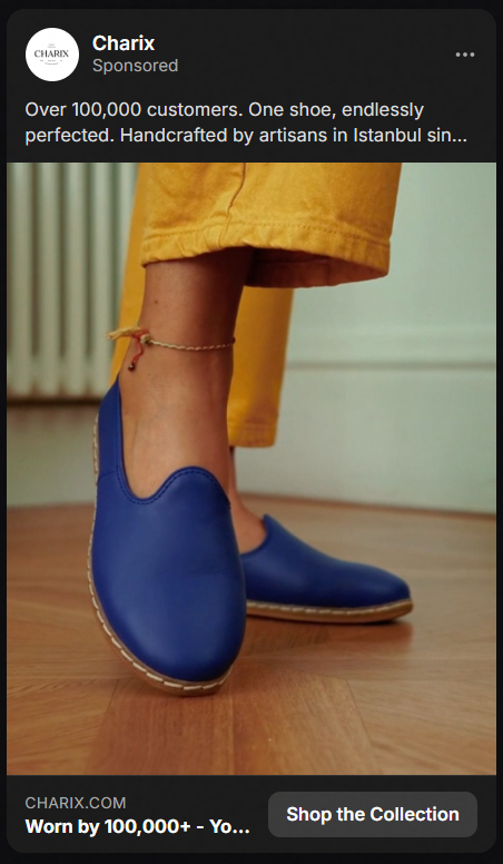 Person wearing bright blue slip-on shoes and mustard yellow pants standing on a wooden floor with a white wall in the background.