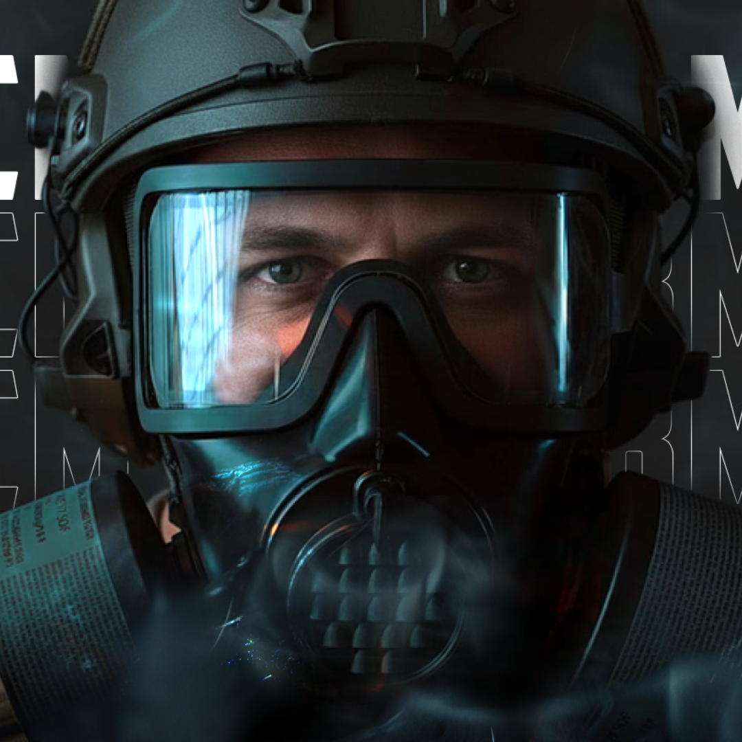 Close-up of a person wearing a black tactical helmet and a full face respirator mask with clear goggles, with smoke around the lower part of the mask.