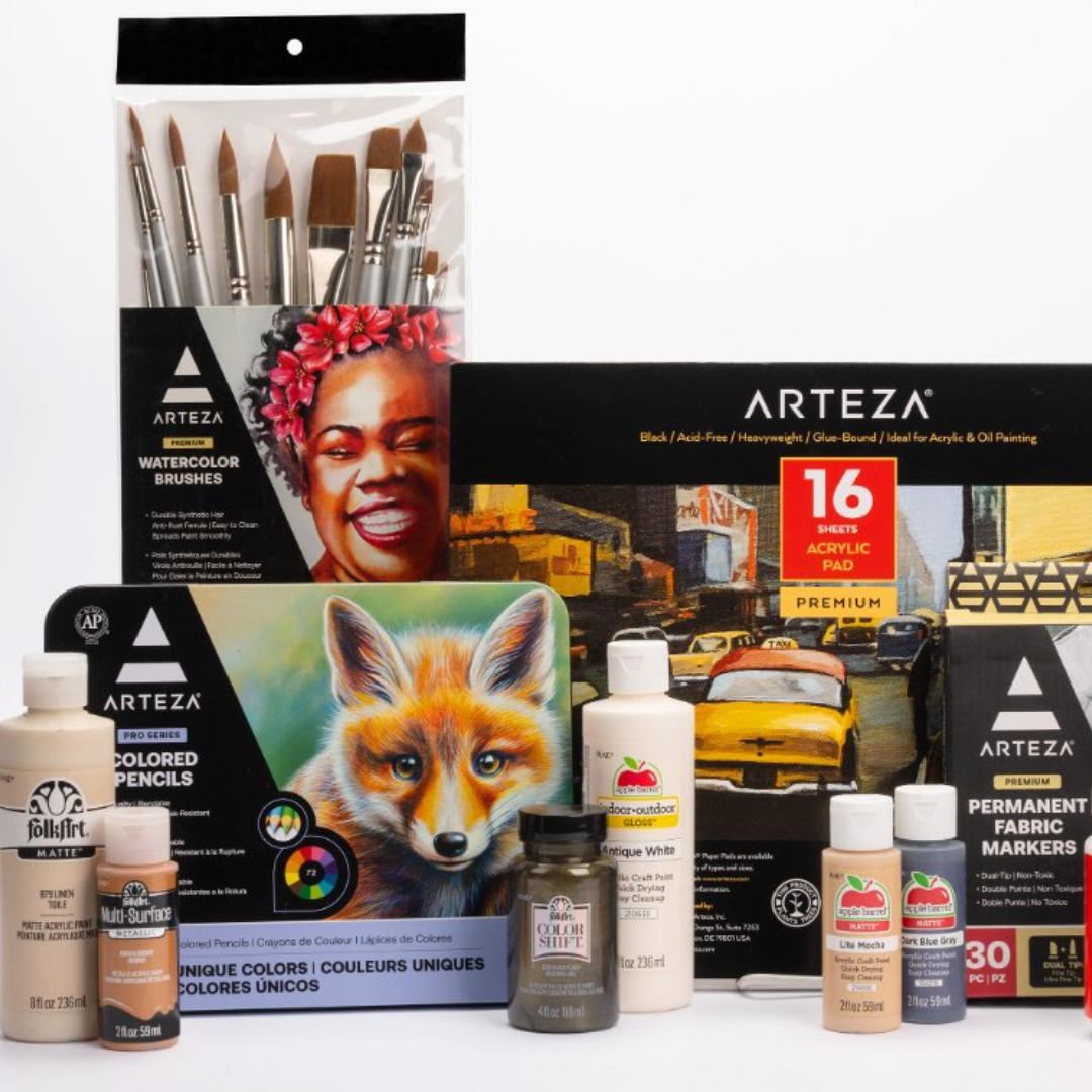 Collection of Arteza art supplies including watercolor brushes, a 16-sheet acrylic pad, colored pencils with a fox illustration on the box, permanent fabric markers, and FolkArt acrylic paints in various colors.