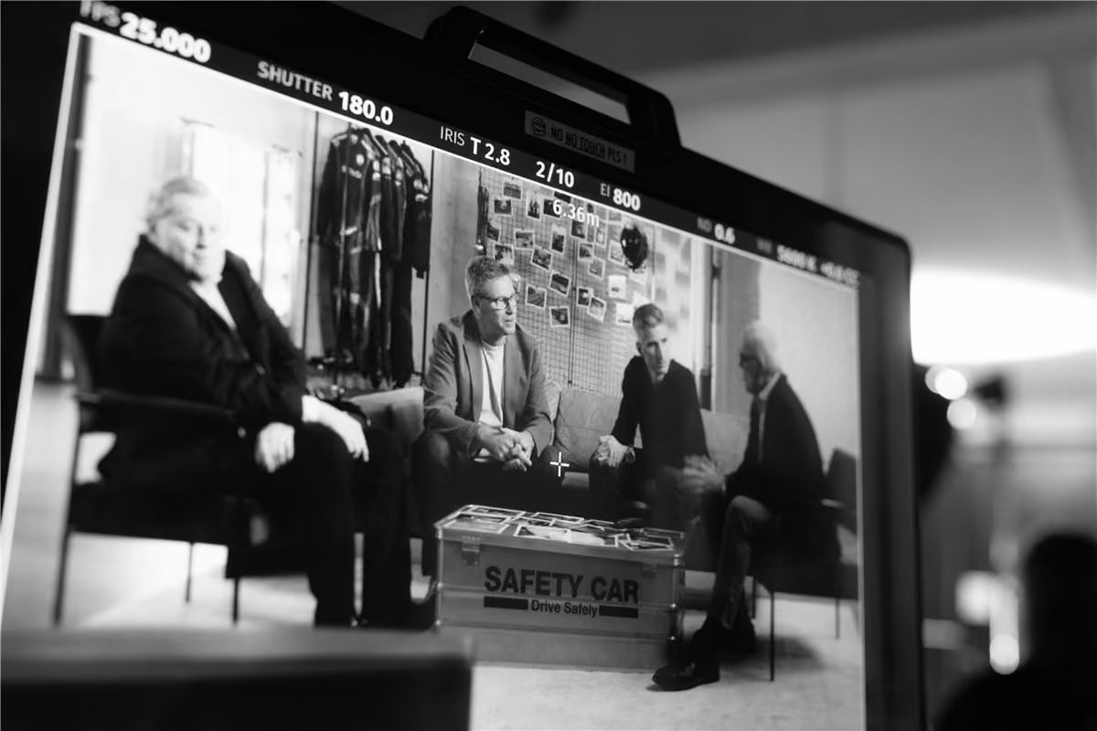 Monitor showing an interview being filmed on set
