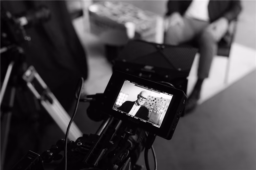 Cinema camera with monitor recording an interview