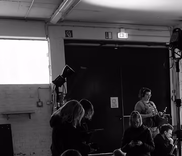 Crew members working on set during a production