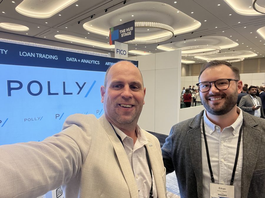 Polly team members at the Polly booth at an MBA conference