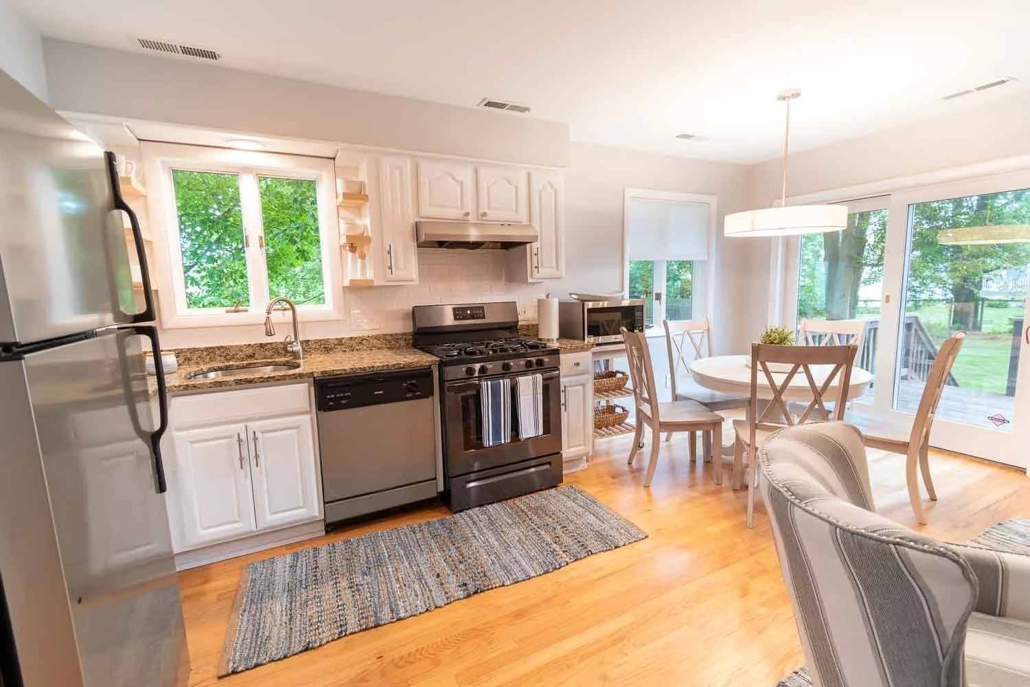 Open kitchen and dining area in a furnished house on Reef Road