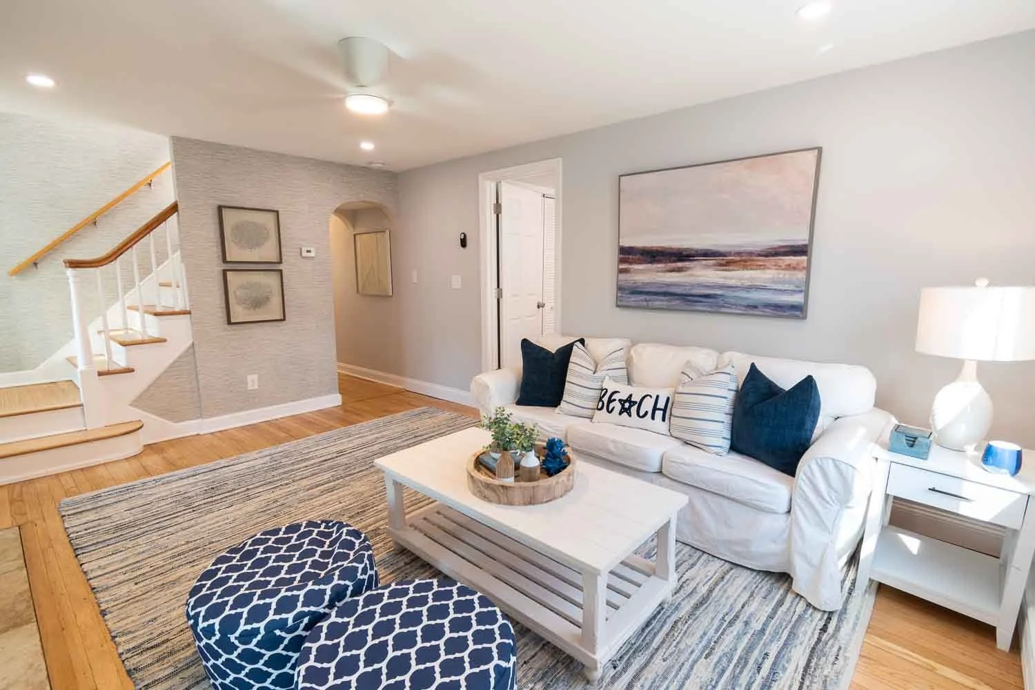 Living room with a white sofa in a furnished house on Reef Road