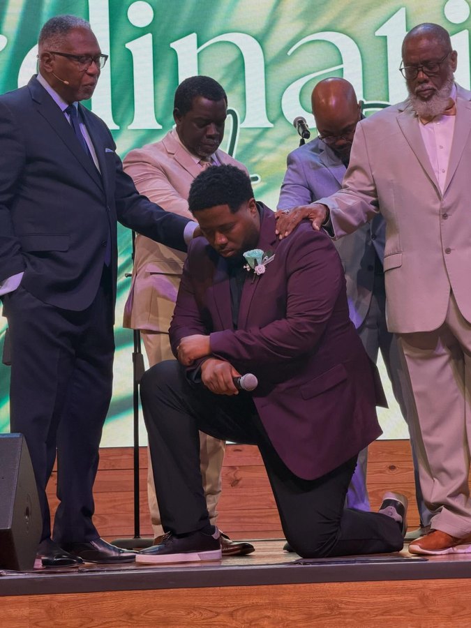 Pastors praying over a member at Living Word Fellowship Church