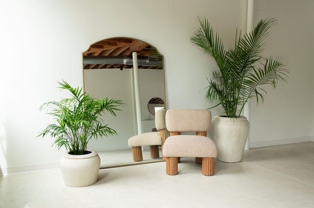 West Edit, boucle chair and palms before the mirror