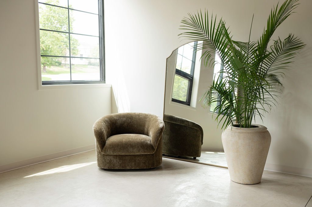 West Edit, olive velvet chair by the window