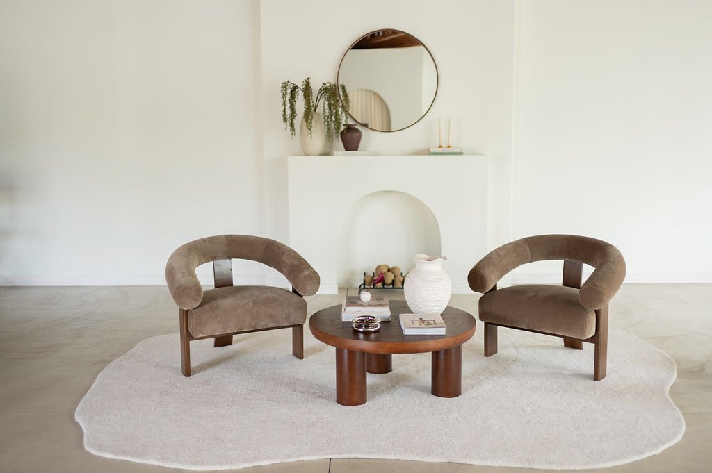 Fireplace Edit, taupe velvet chairs and round table before the mantel