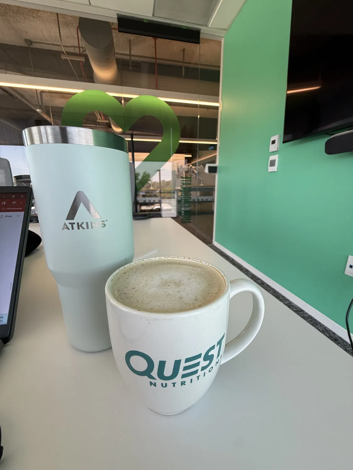 Atkins tumbler and Quest coffee mug at the office