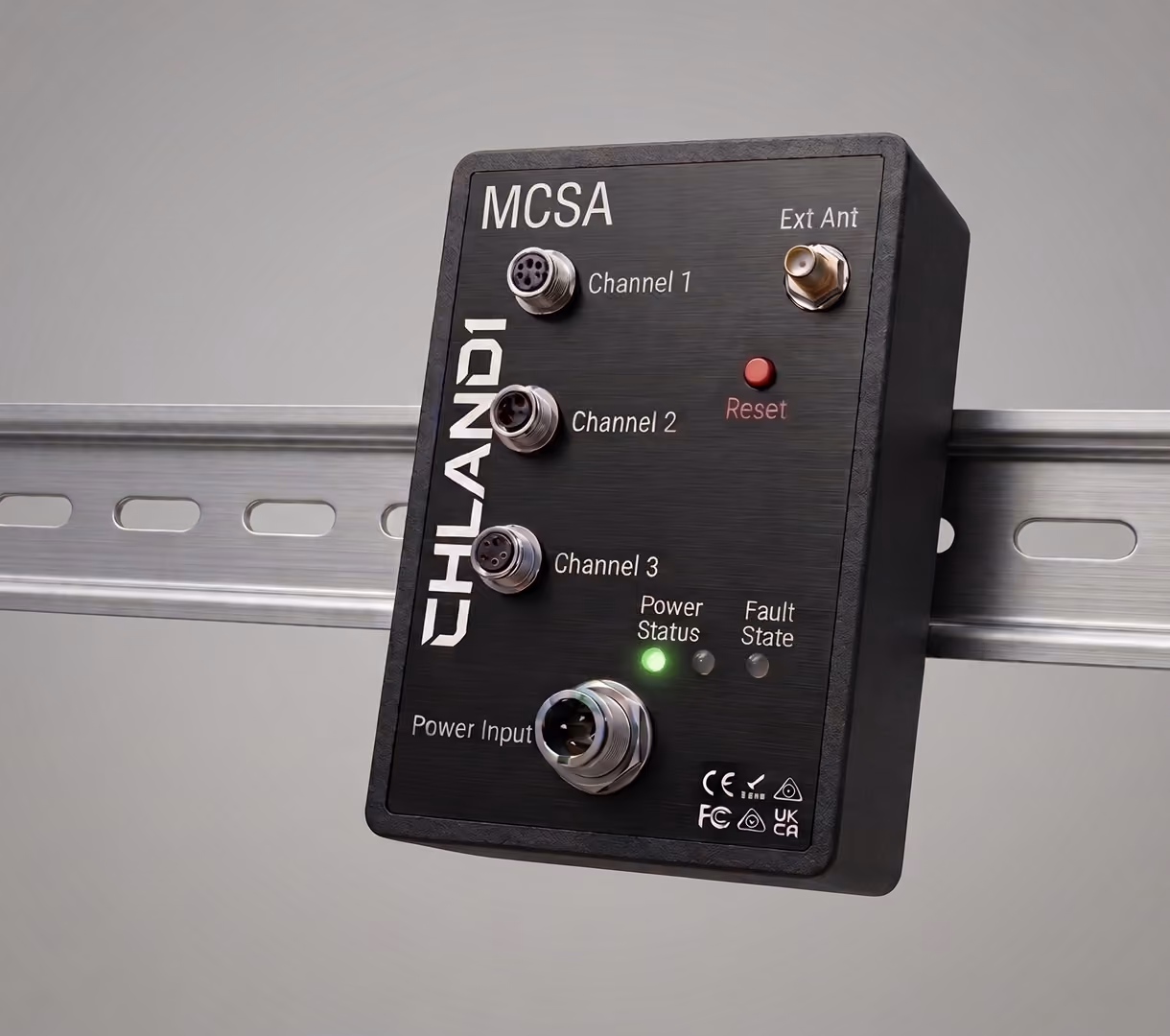 Black Chlandi MCSA module mounted on a metal rail with labeled connectors for Channel 1, Channel 2, Channel 3, Ext Ant, and Power Input, a red Reset button, and indicator lights for Power Status (green), Fault, and State.
