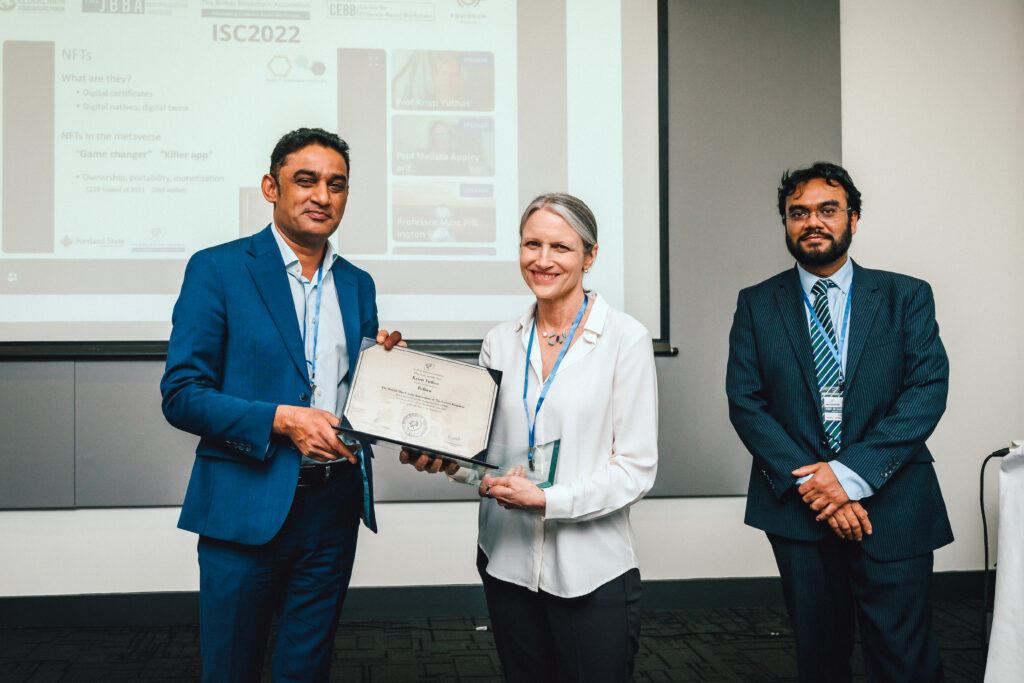 Professor Kristi Yuthas receiving her Fellowship at ISC2023