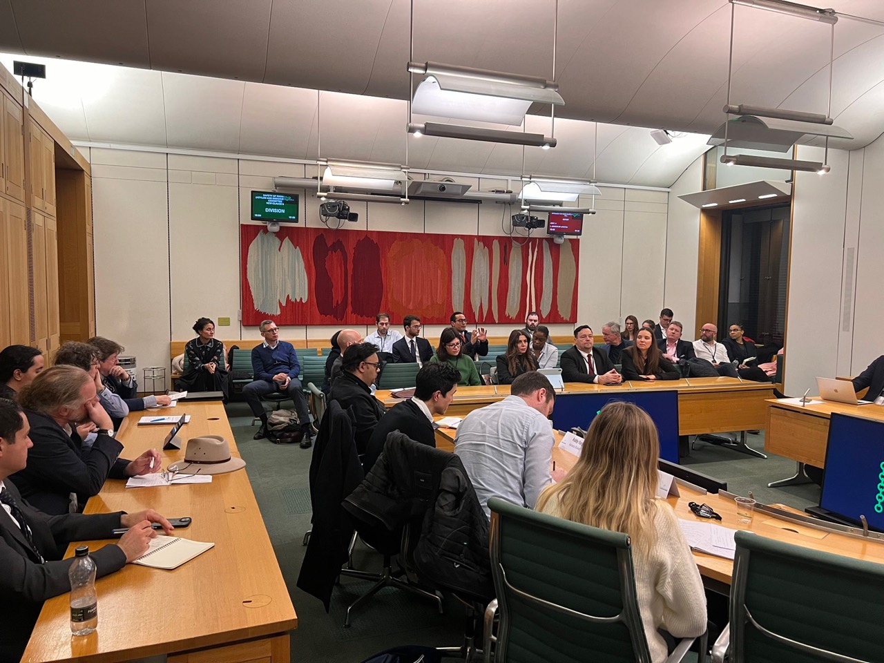 Participants contributing to a parliamentary discussion on blockchain technologies