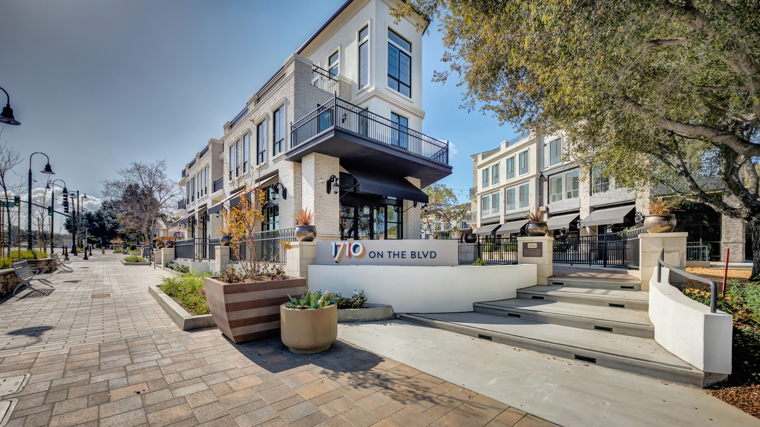 Hero: exterior of a PMC community at golden hour