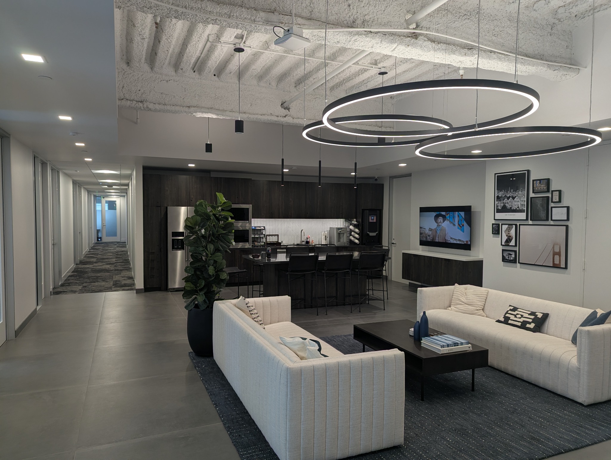 Lounge seating and circular lighting at One Sansome Street