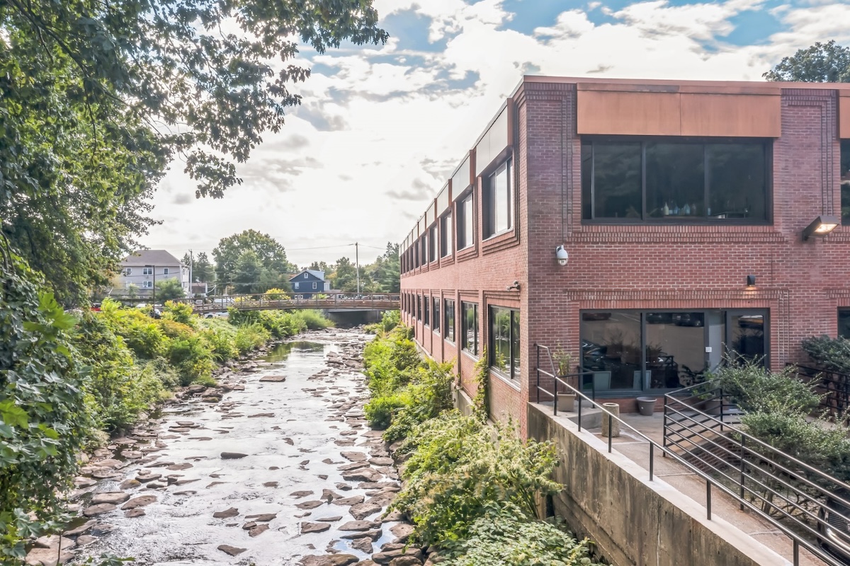 Brick office building beside a river in Greenwich
