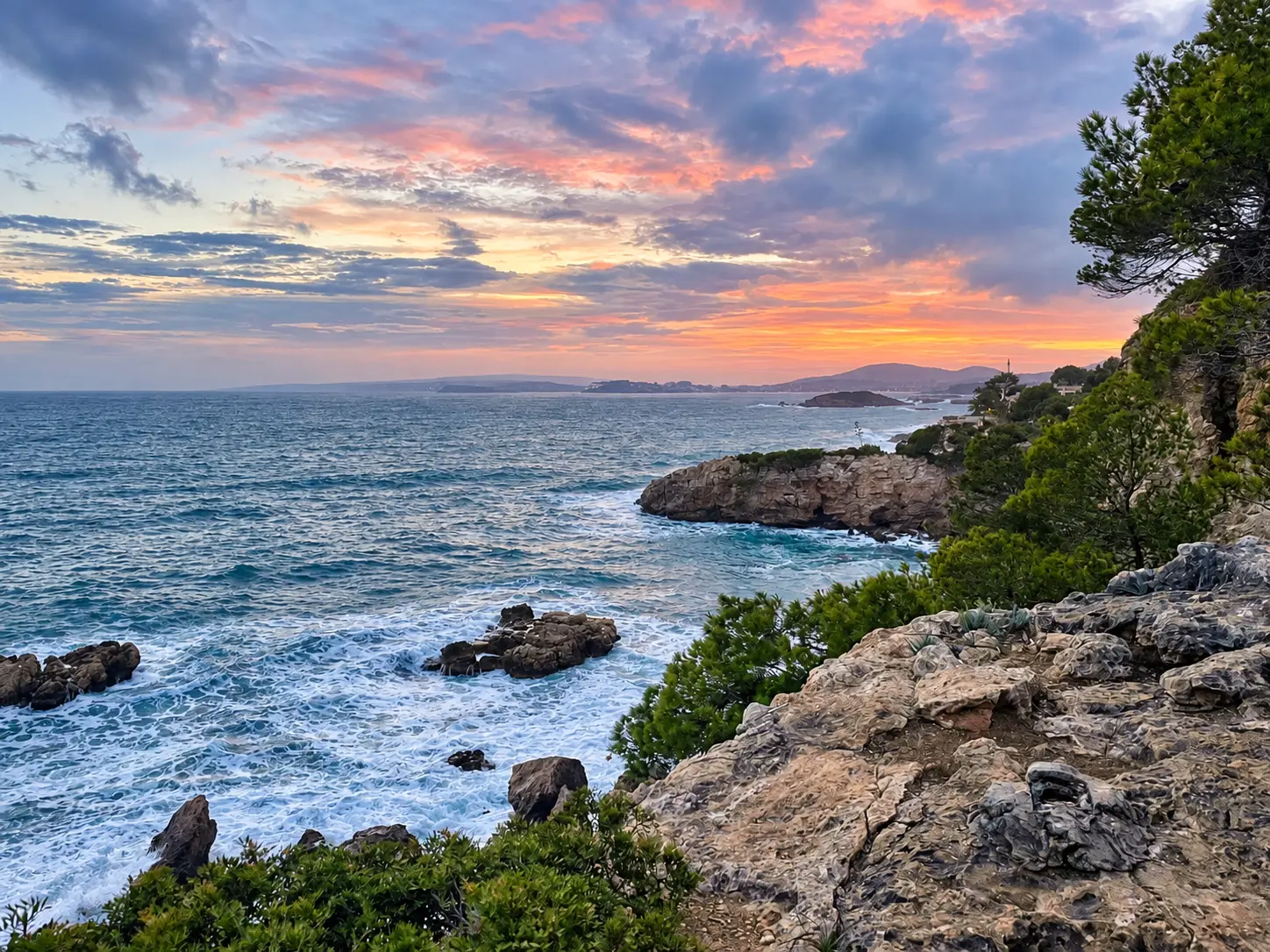 Rocky Bendinat coastline and Mediterranean Sea at sunset
