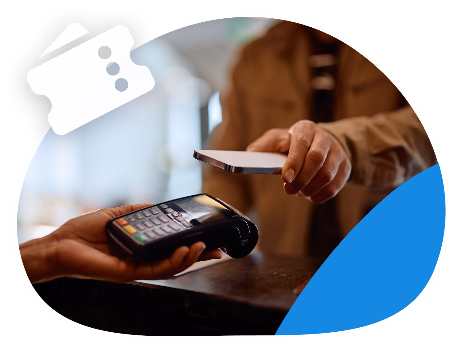 Person holding a smartphone near a payment terminal for contactless payment, with another hand holding the terminal.