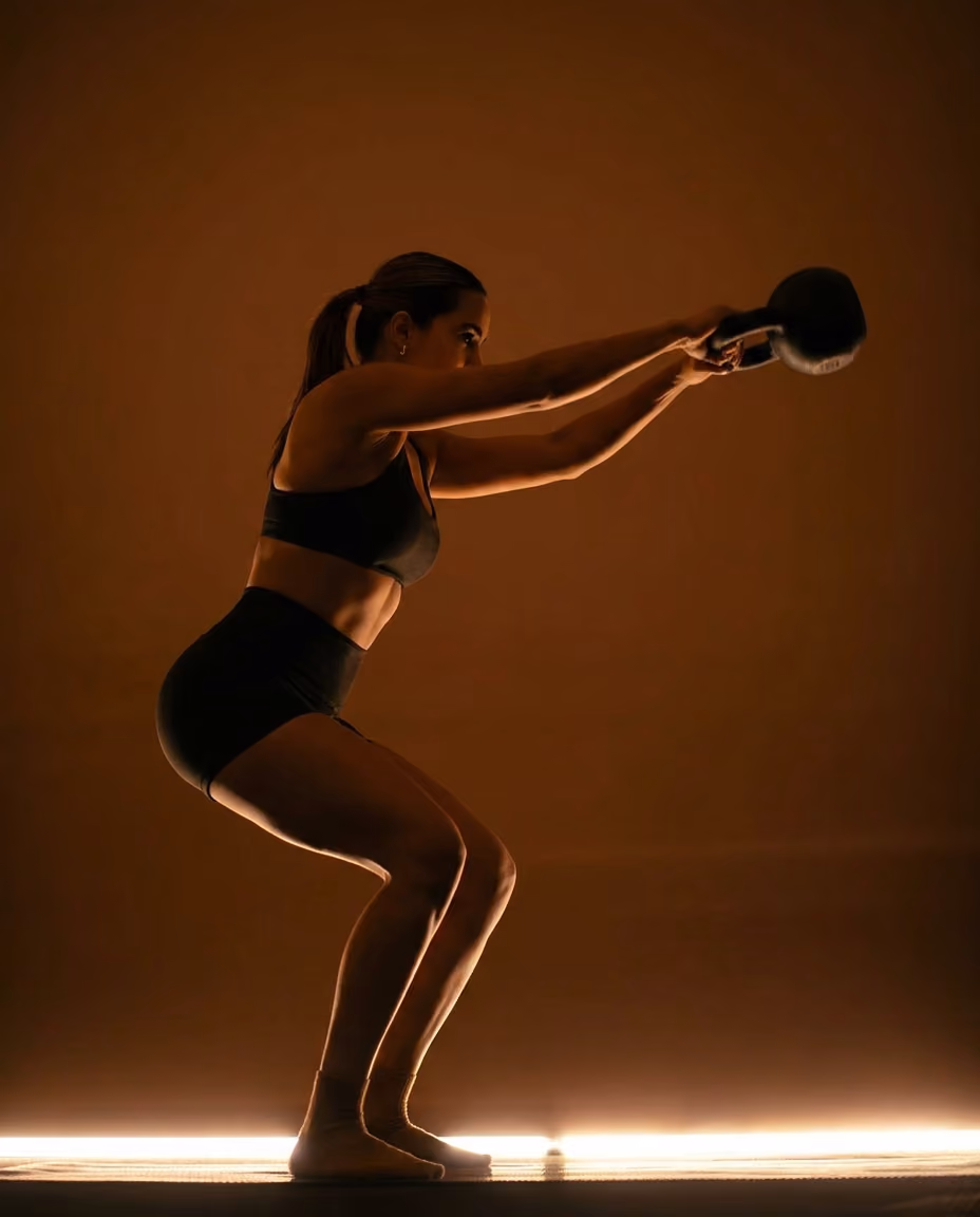 A person doing kettlebell swings