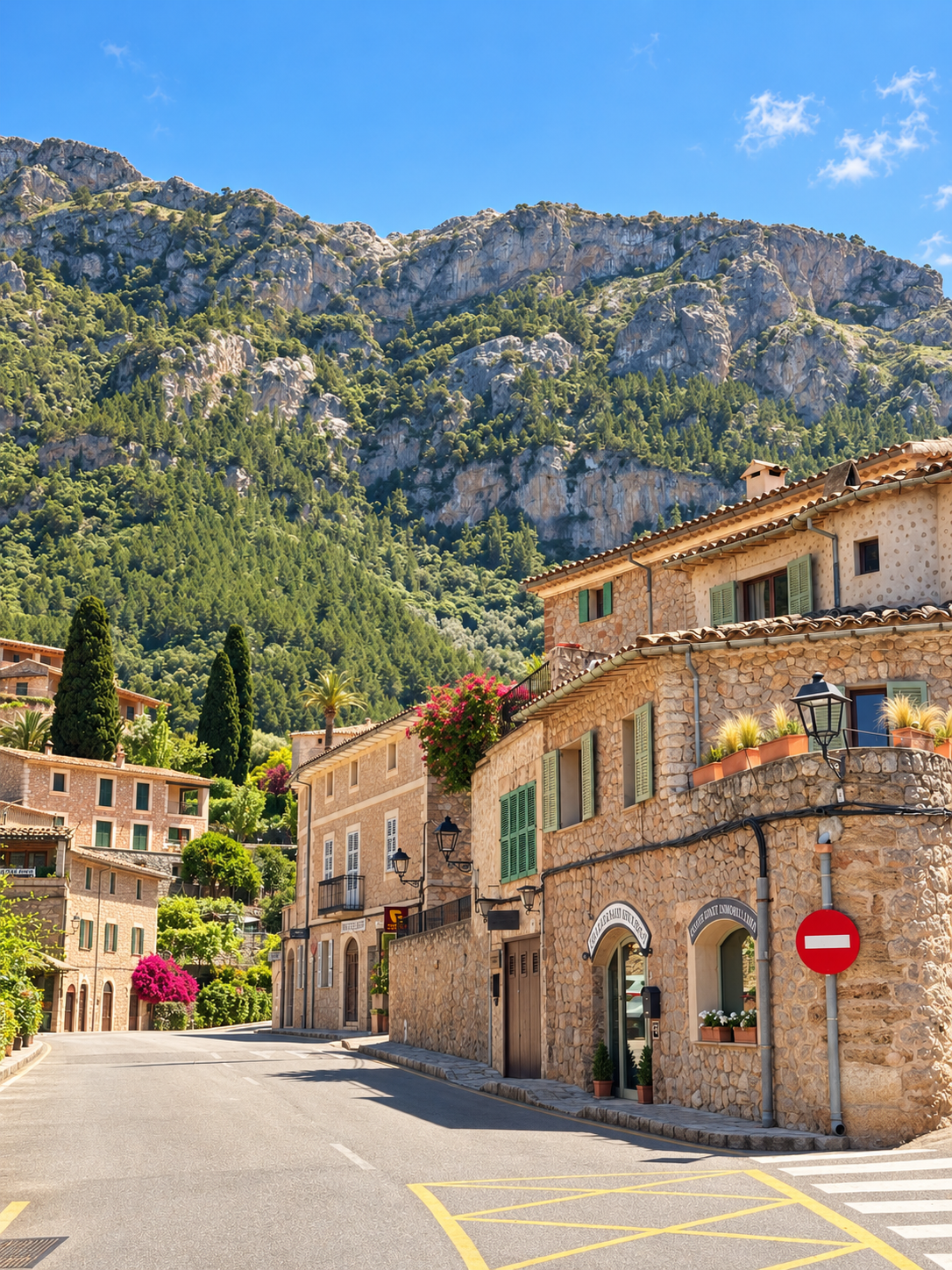 Mallorca area guide Stone houses beneath the Tramuntana mountains in Deià, Mallorca