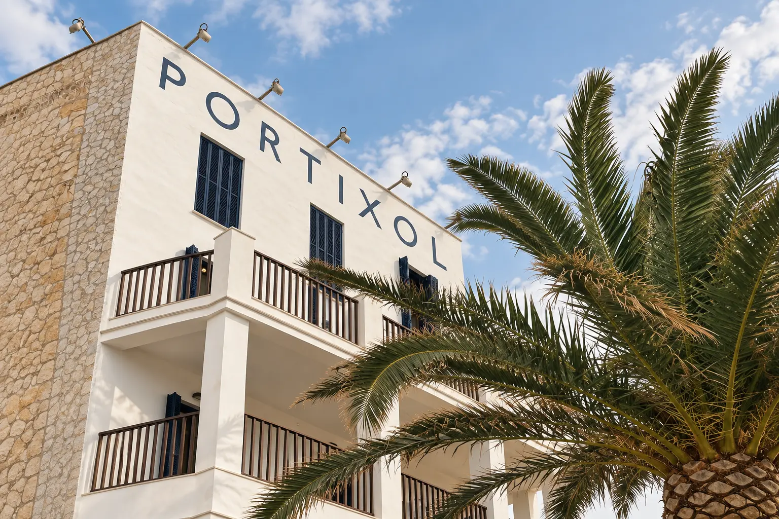 Mallorca area guide Portixol hotel building and palm tree in Portixol, Palma