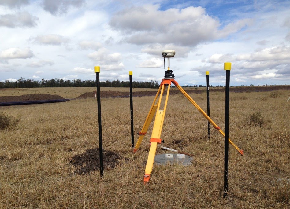 GPS rover on tripod in a paddock
