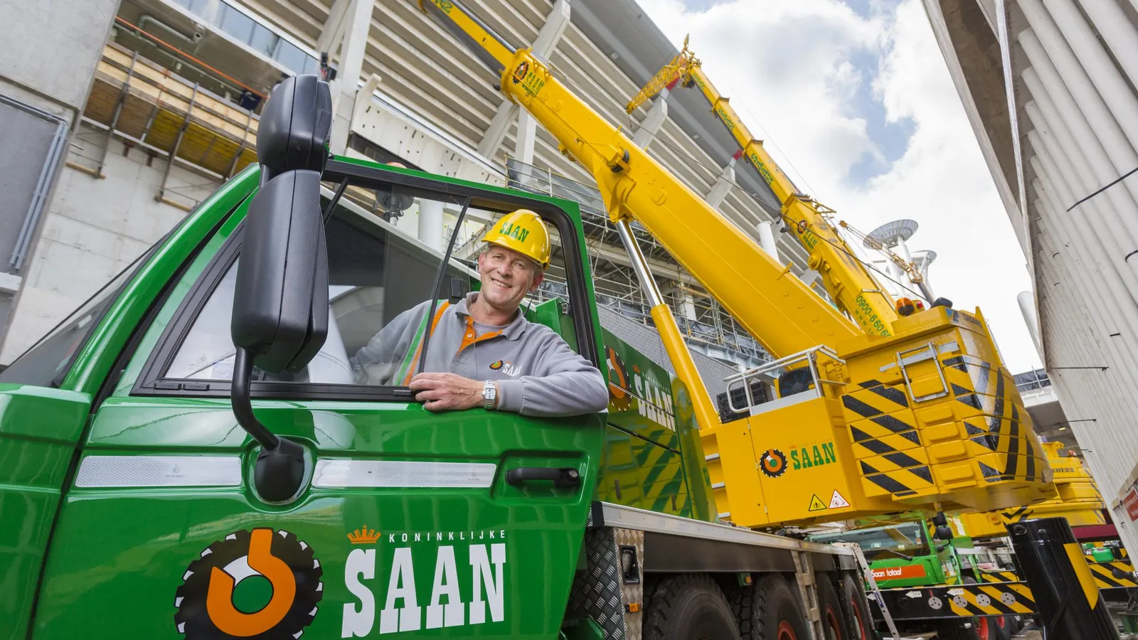 Crane operator of Koninklijke Saan in the cab of a mobile crane