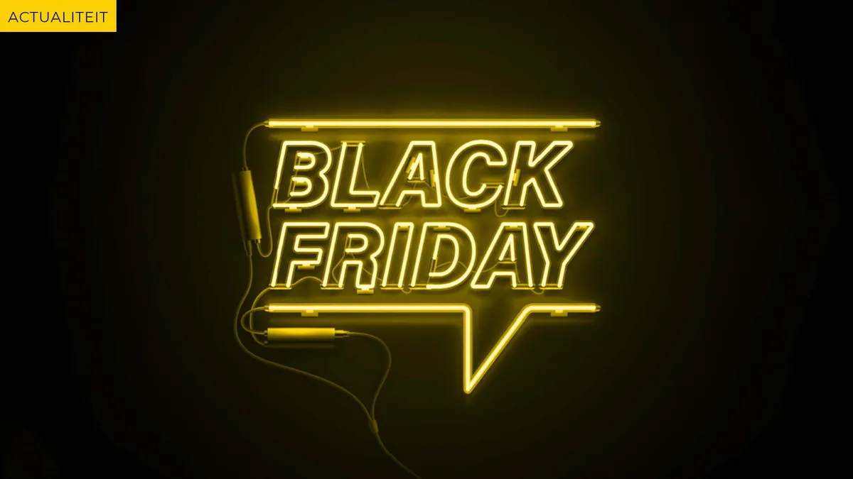 Neon letters reading Black Friday in a speech bubble on a dark background