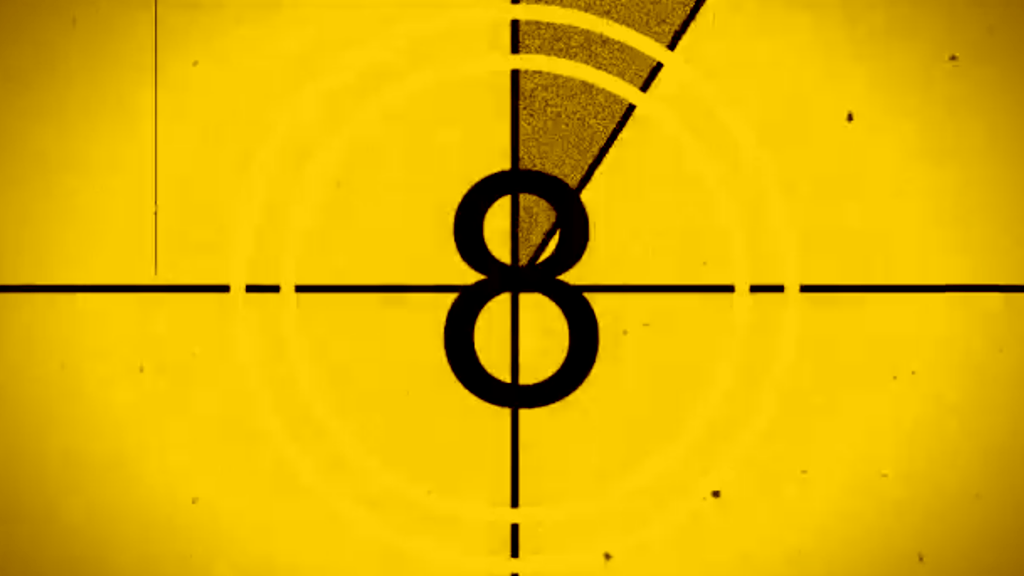 Yellow film countdown with a black 8 and crosshairs