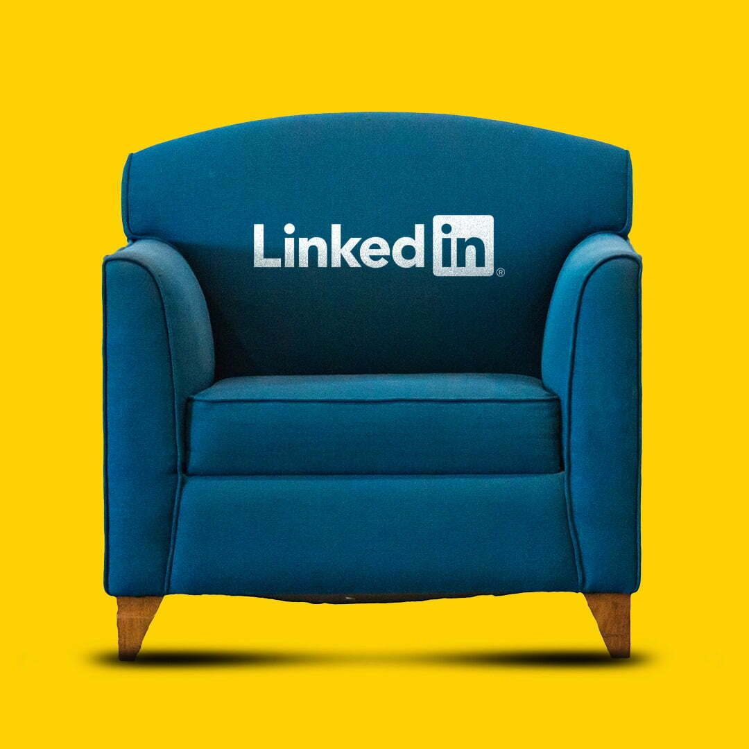Blue armchair with the LinkedIn logo on the backrest against a yellow background
