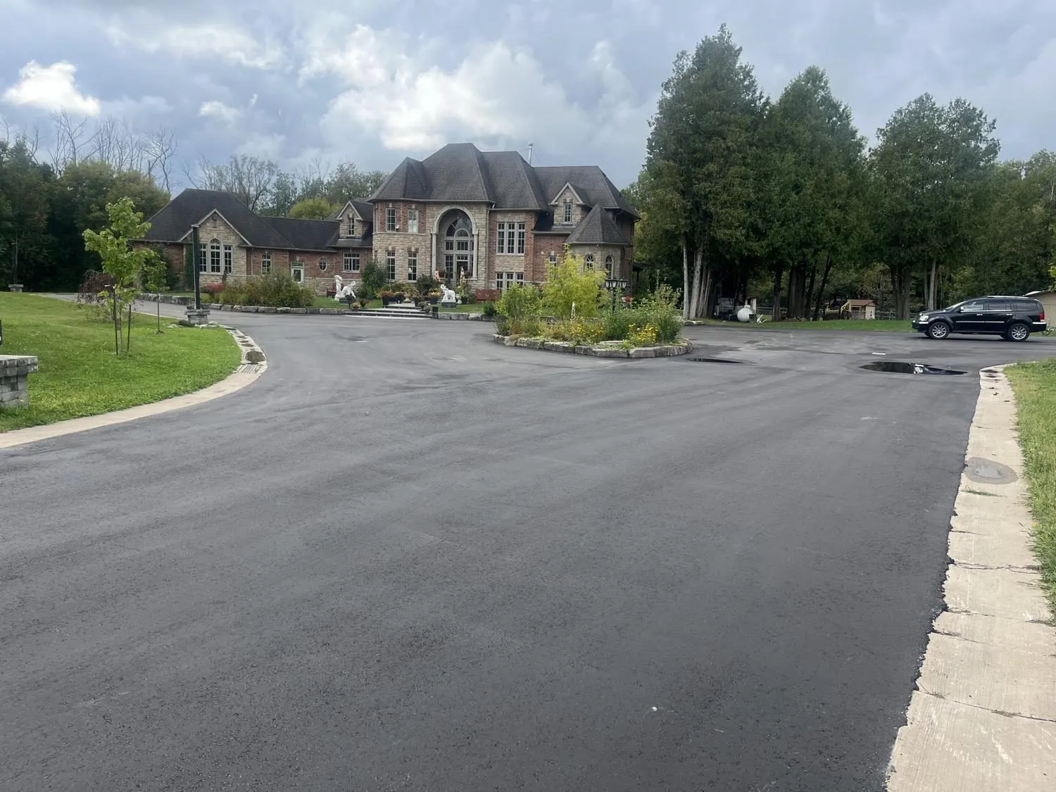 Fresh asphalt on a private court surrounded by estate homes