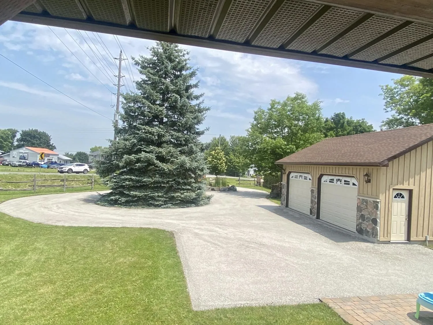 Circular gravel driveway on a rural Durham Region property