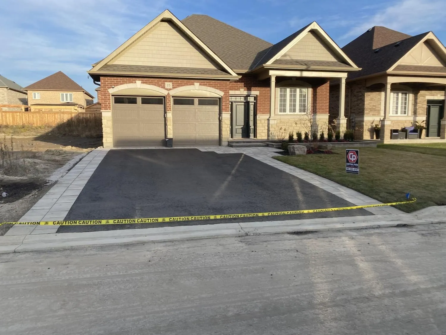 New asphalt driveway at a newly built home
