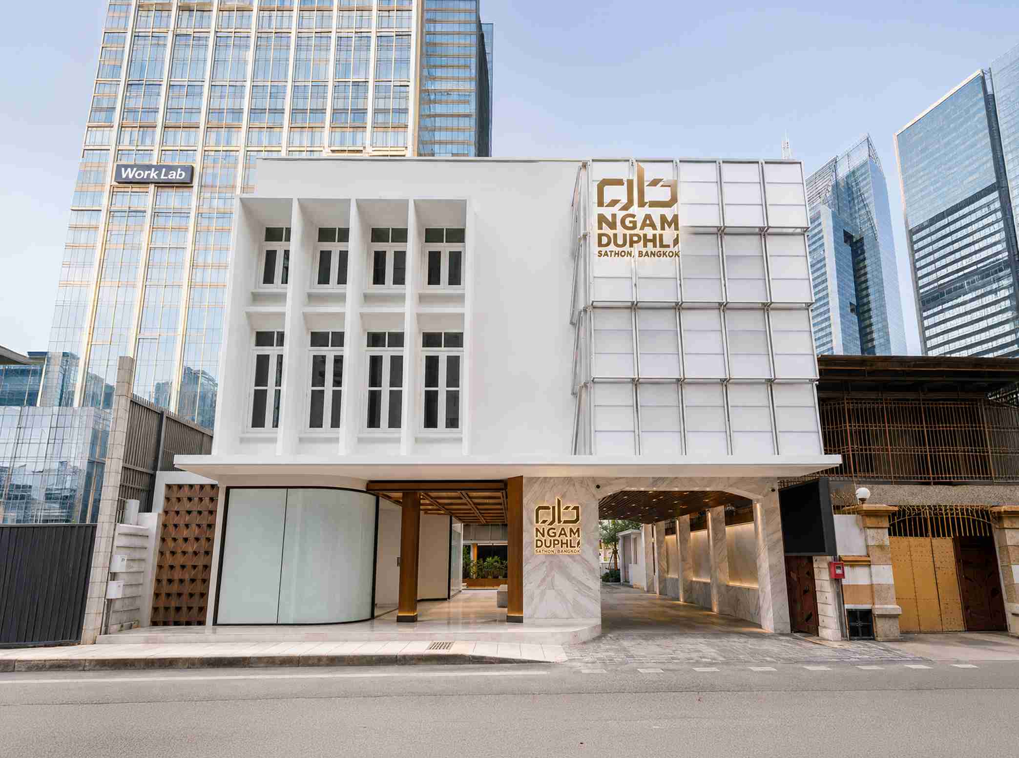 Back Building exterior facade in daylight, current signage