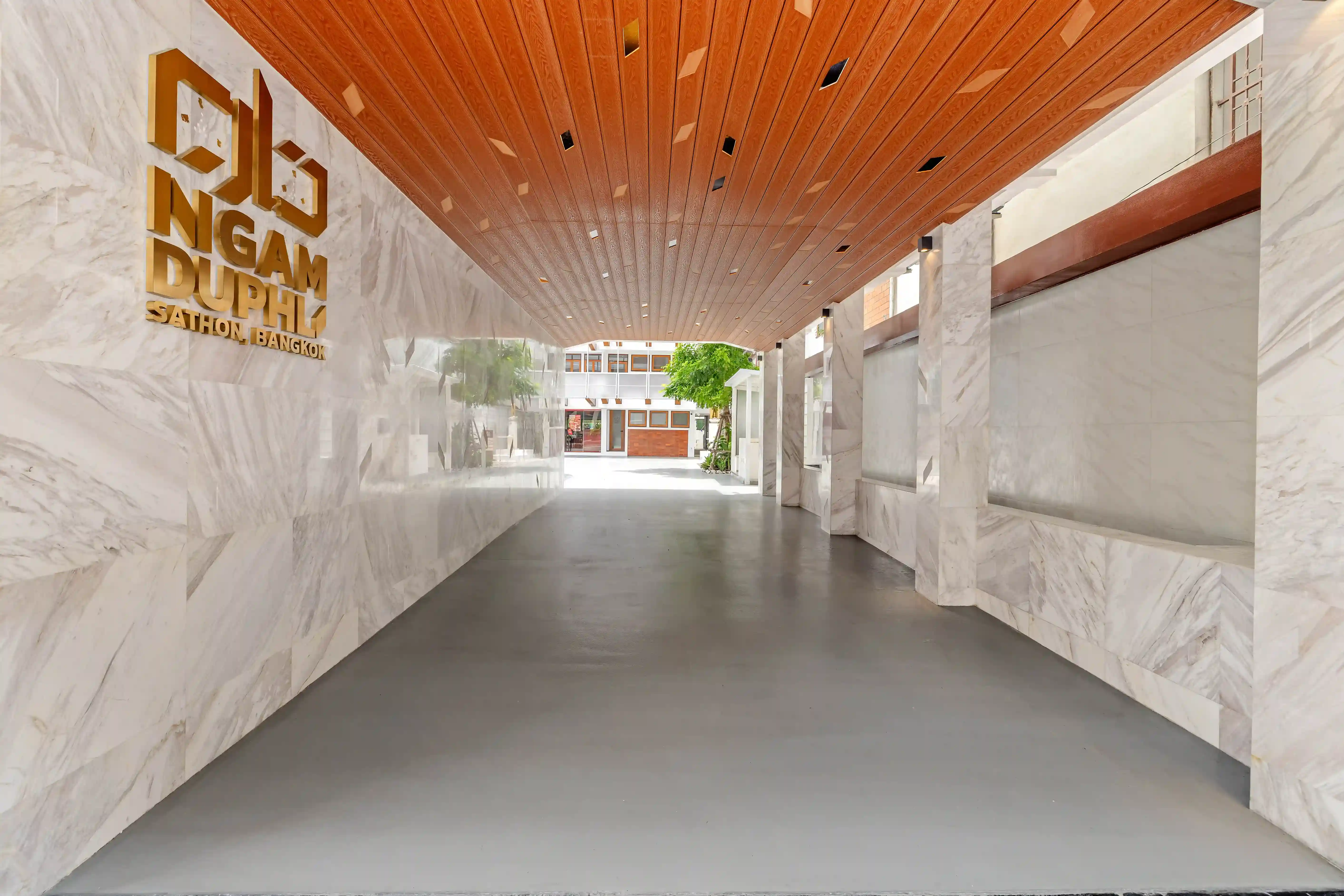 Front Building street-level entrance, curved glass and timber ceiling