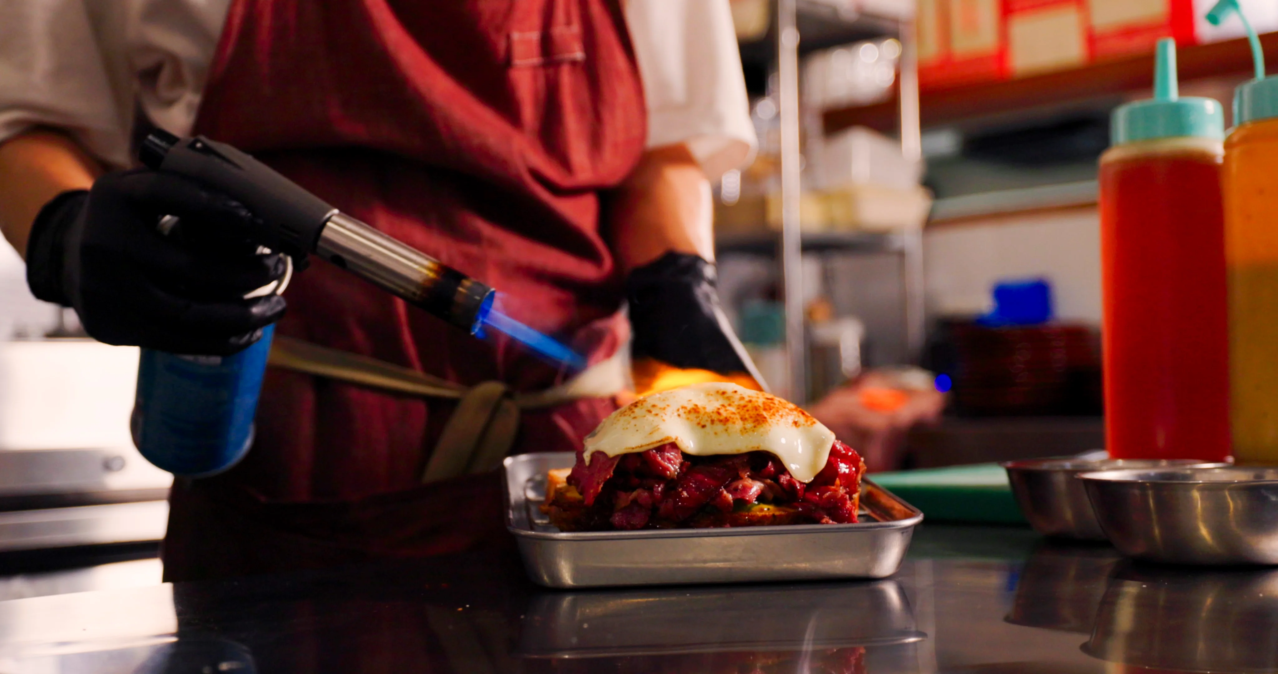 BURNT sandwich being finished with a kitchen torch