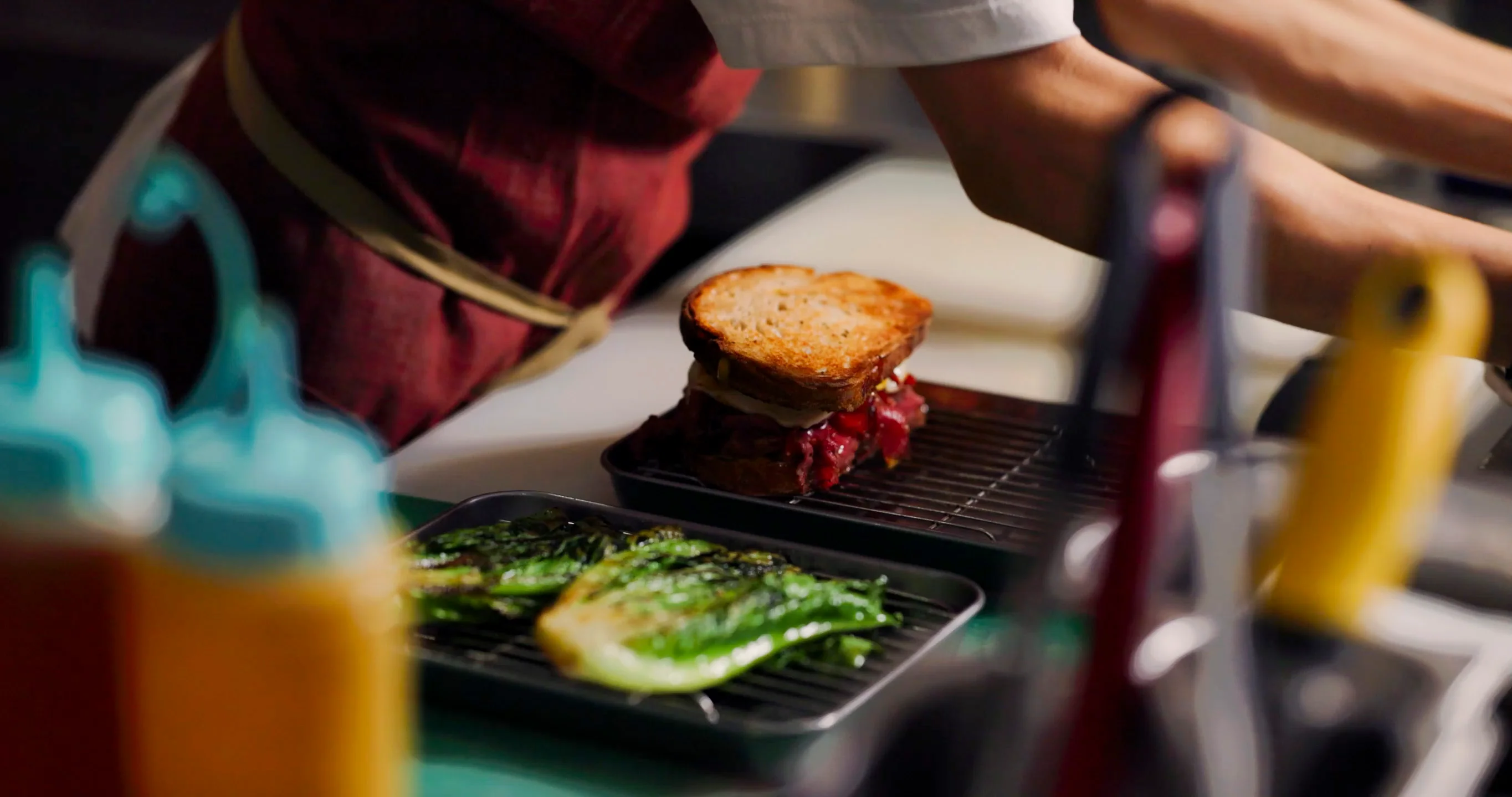 A BURNT sandwich plated with grilled romaine
