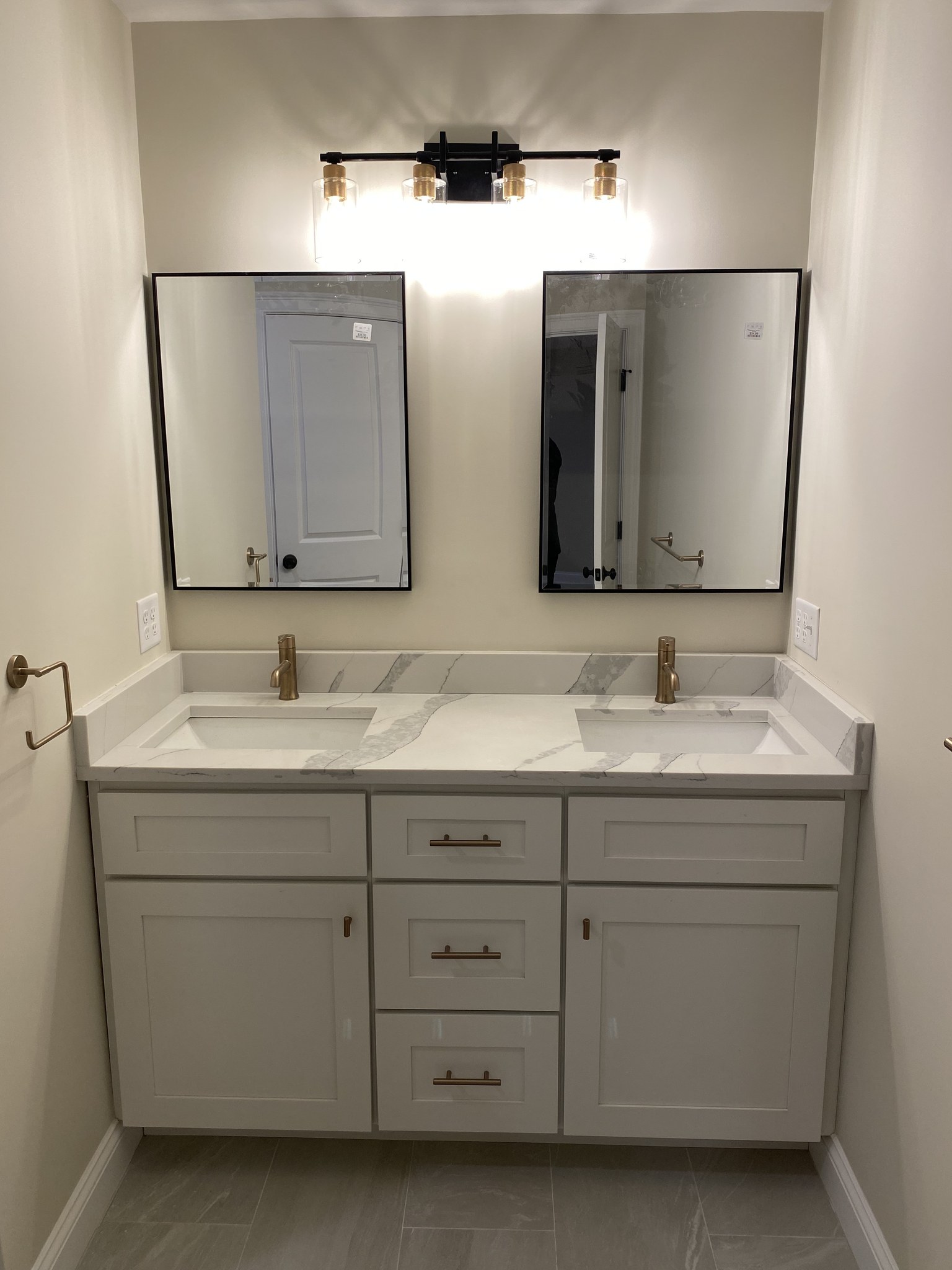 Double vanity with framed mirrors in a Wilmington new-construction bathroom