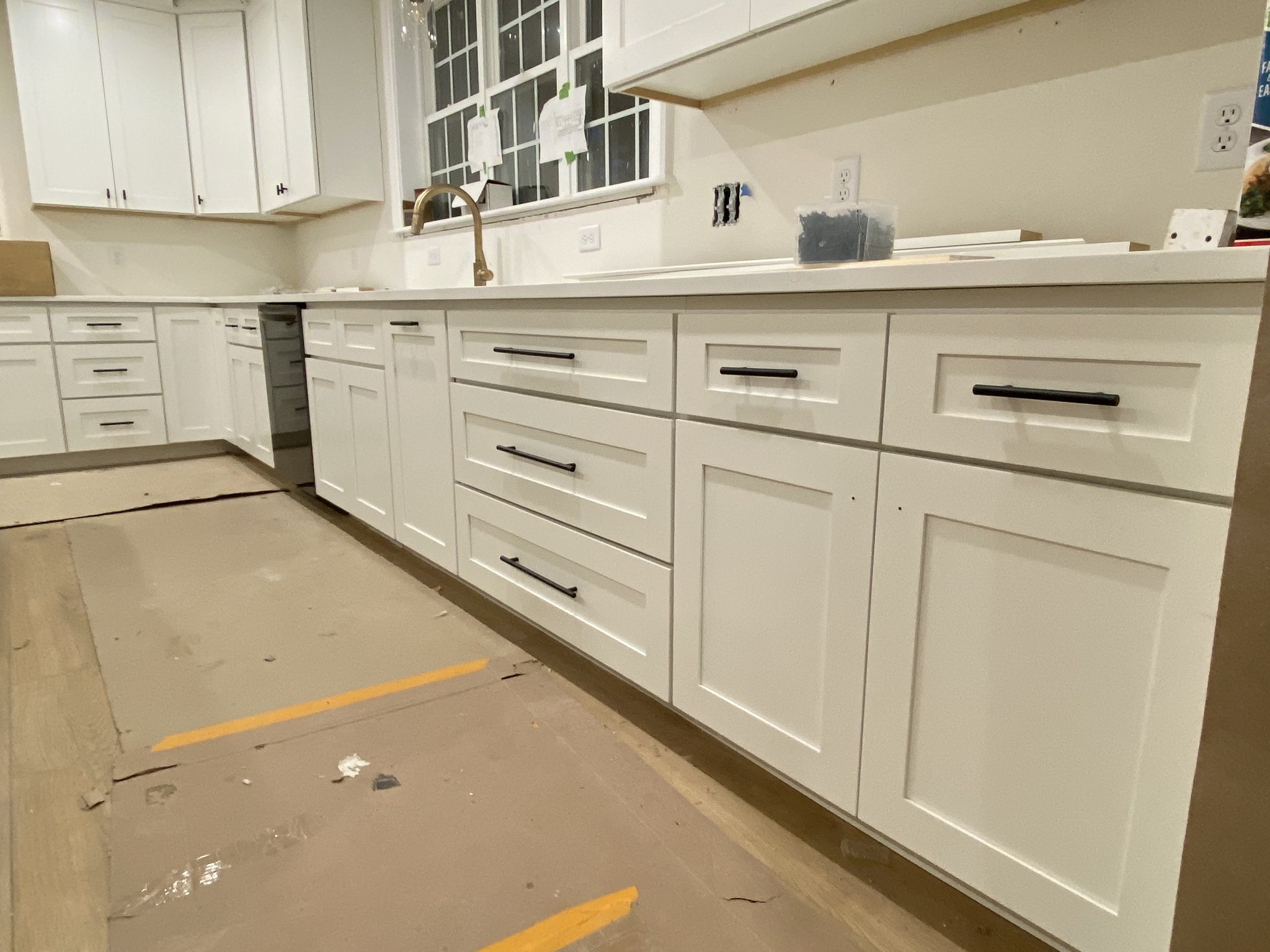 Perimeter kitchen run with shaker cabinets and quartz counters, Wilmington new construction