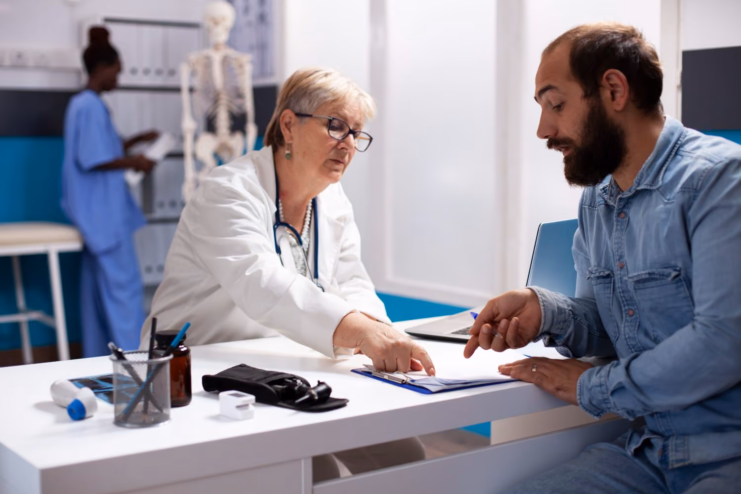 A patient completing a preoperative health questionnaire in a clinic waiting area