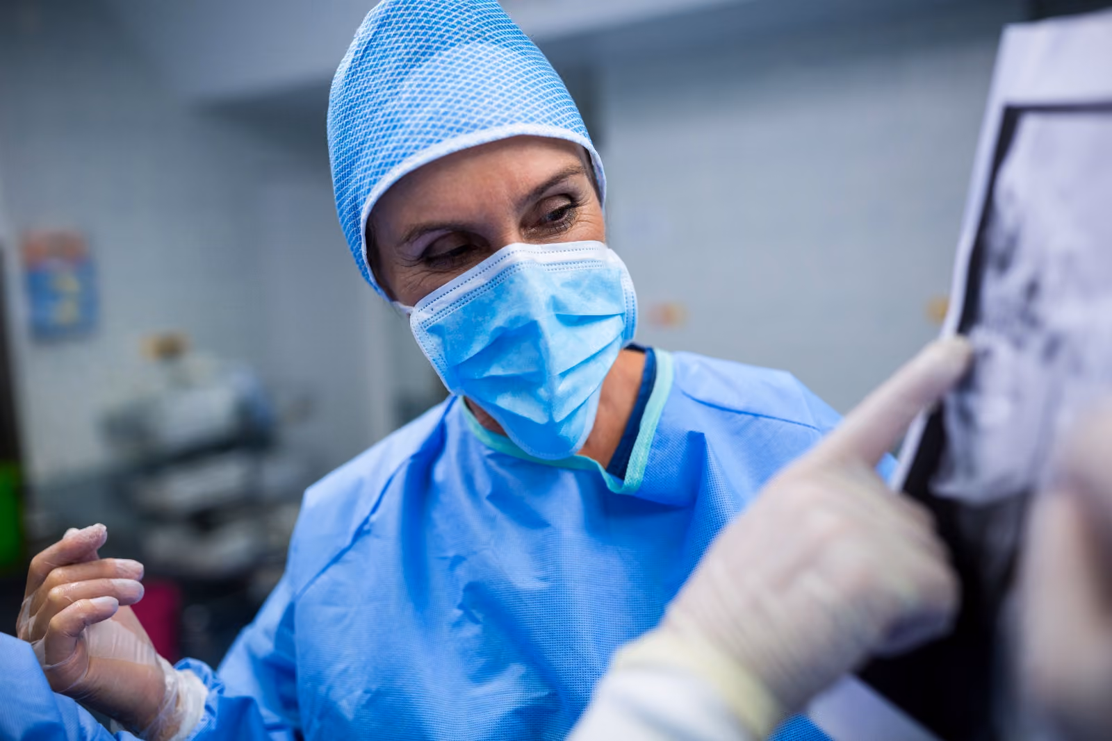 A clinician talking a patient through their results on screen during a preoperative review