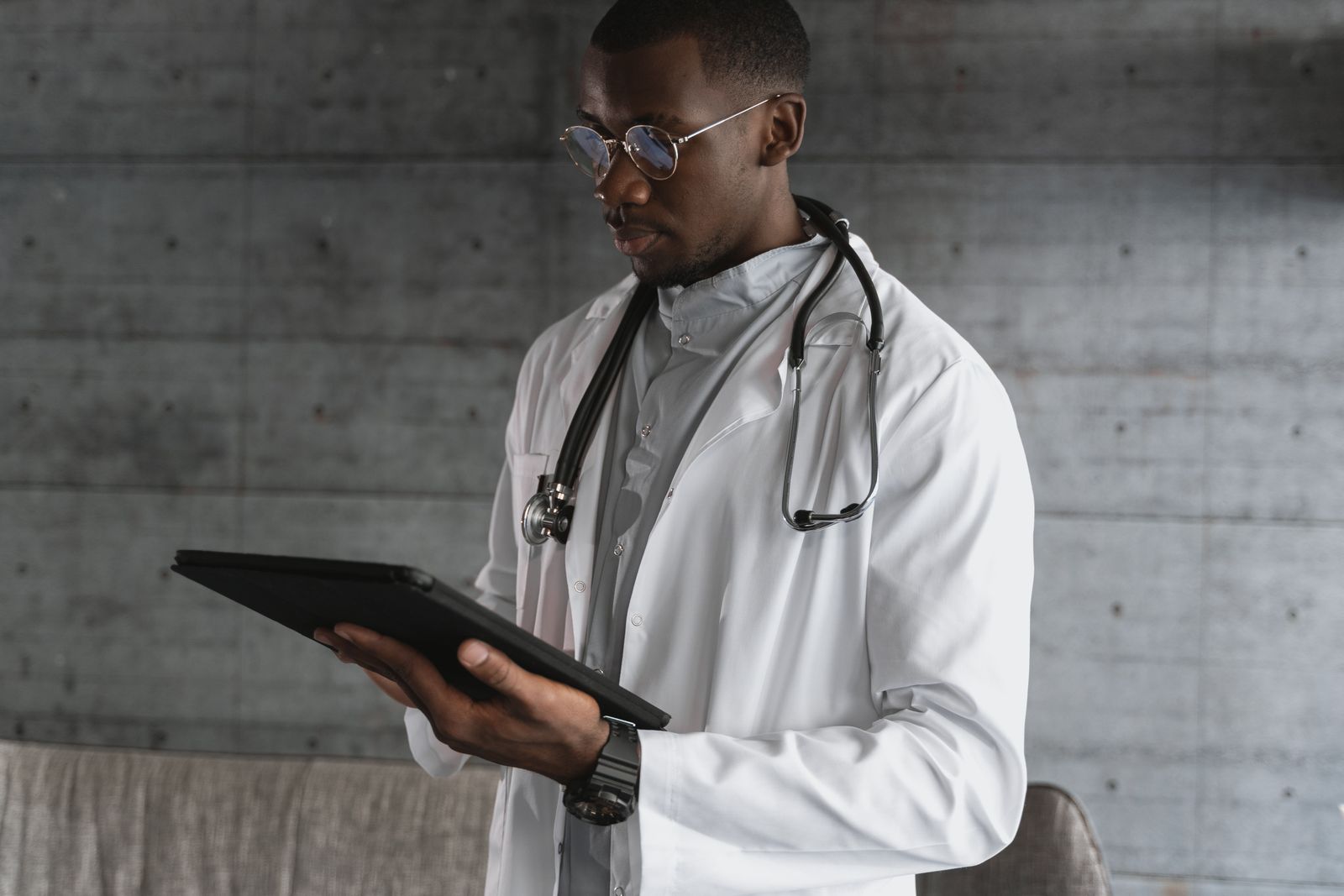Physician using a tablet in a clinical setting
